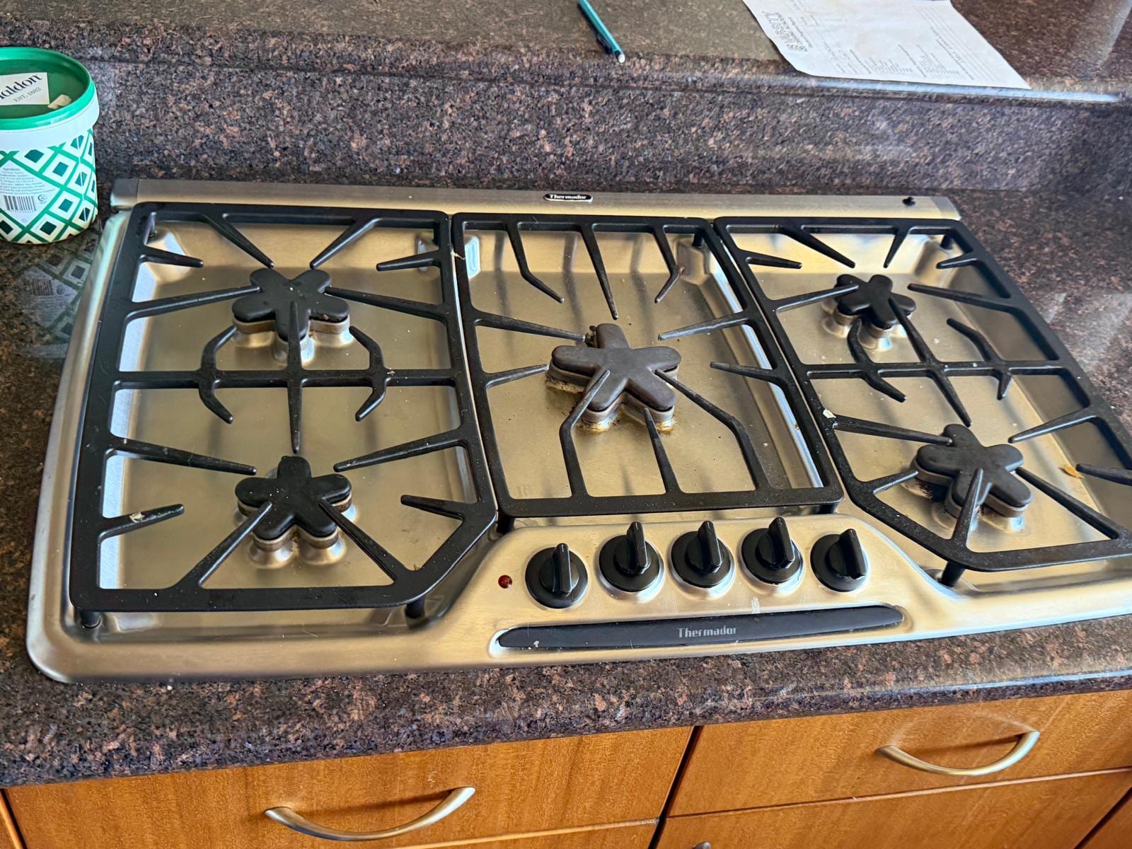 Stainless Thermador five-burner gas cooktop serviced for nonstop igniter clicking in a Santa Ana kitchen