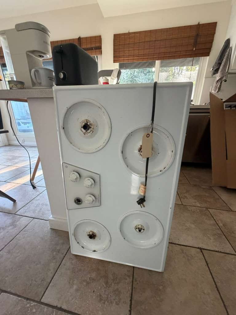 White cooktop removed from a Fullerton kitchen