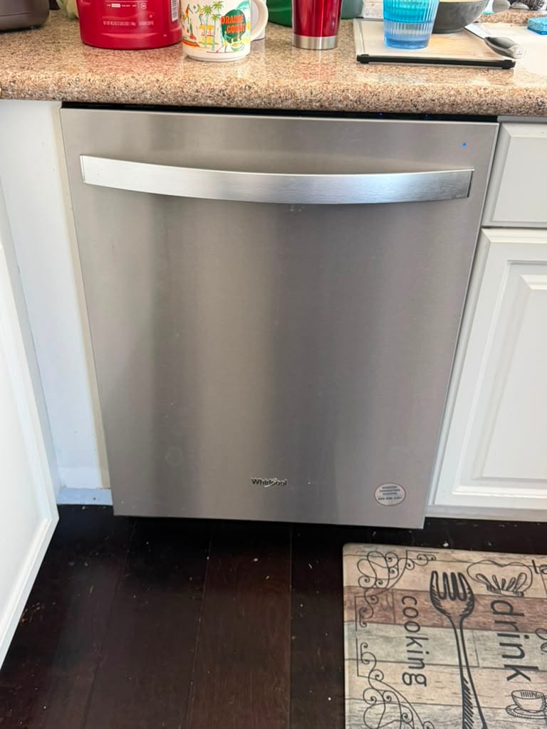 Stainless Whirlpool built-in dishwasher in an Orange County kitchen