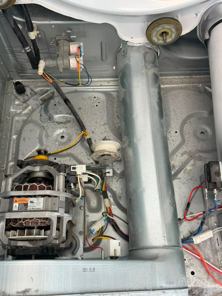 LG dryer drive motor, blower housing, and wiring exposed during diagnosis in Santa Ana