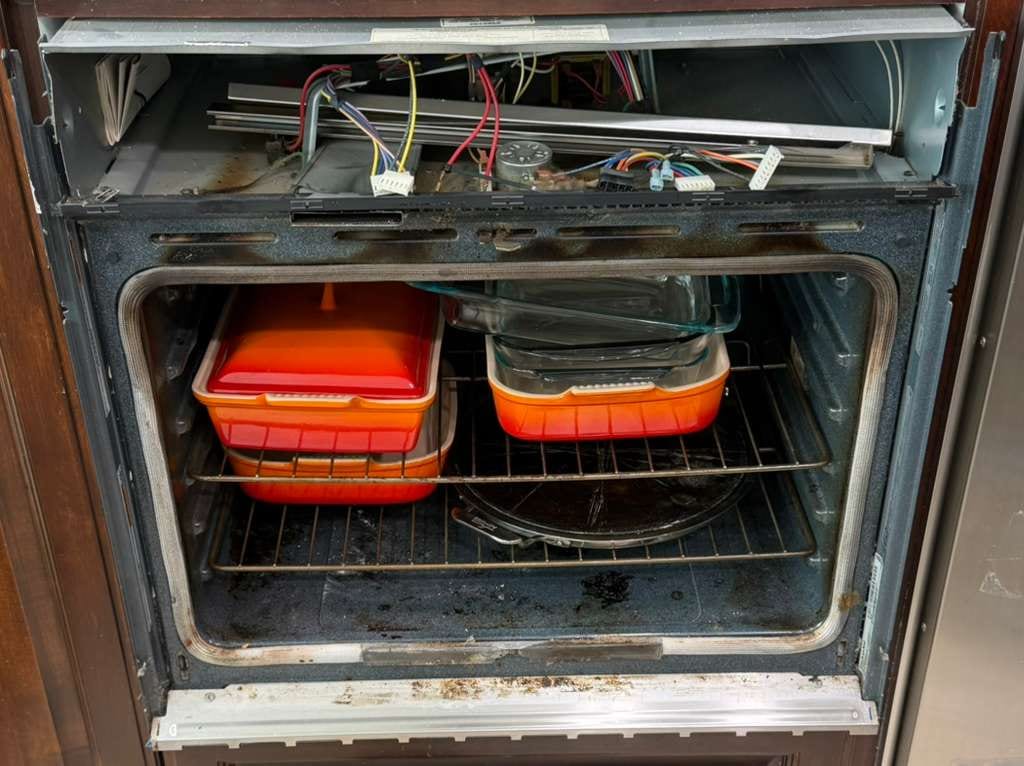 KitchenAid electric wall oven with the control panel opened to access the oven control board during a San Clemente repair