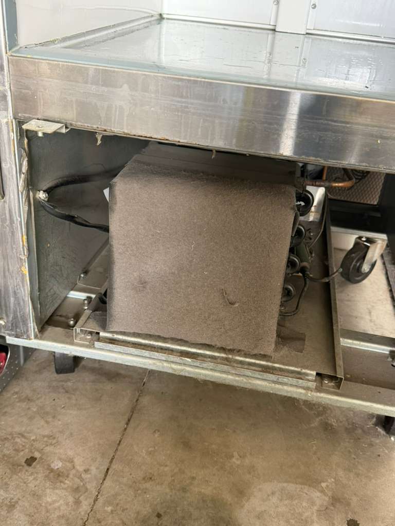 Refrigerator condenser coils cleaned during a service call in Pico Rivera
