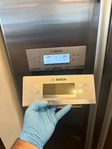 Bosch refrigerator open during a temperature diagnostic by a Universal Appliances Repair technician in Orange County