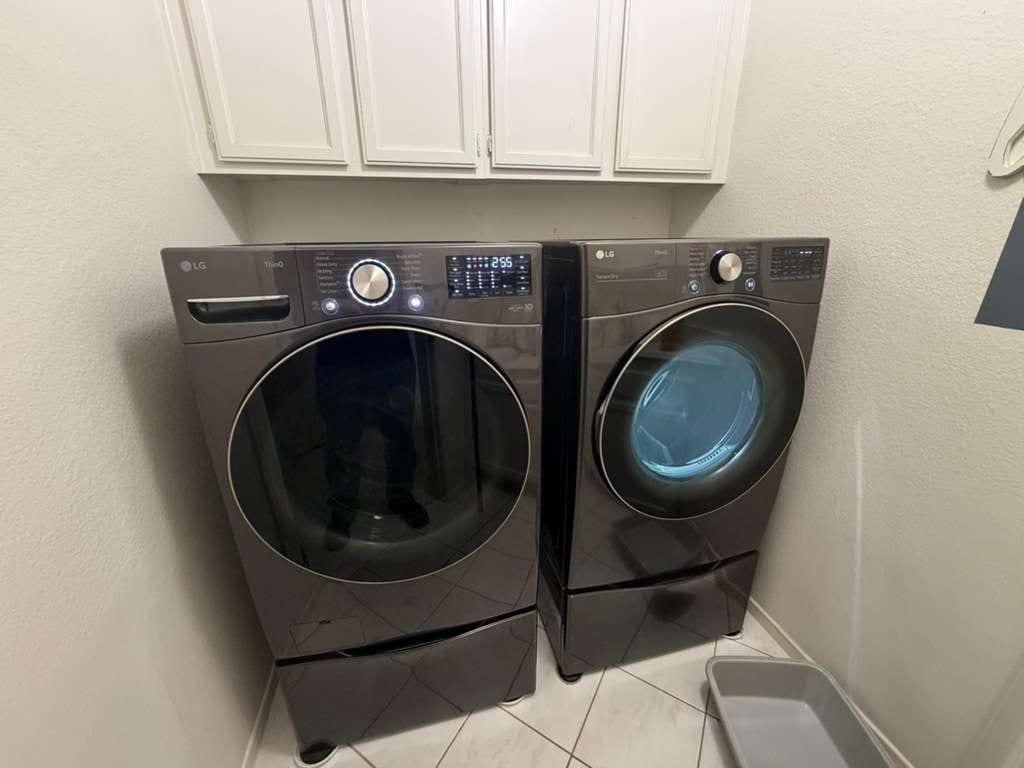 Graphite LG front-load washer and dryer side by side in a Foothill Ranch laundry room during a maintenance visit