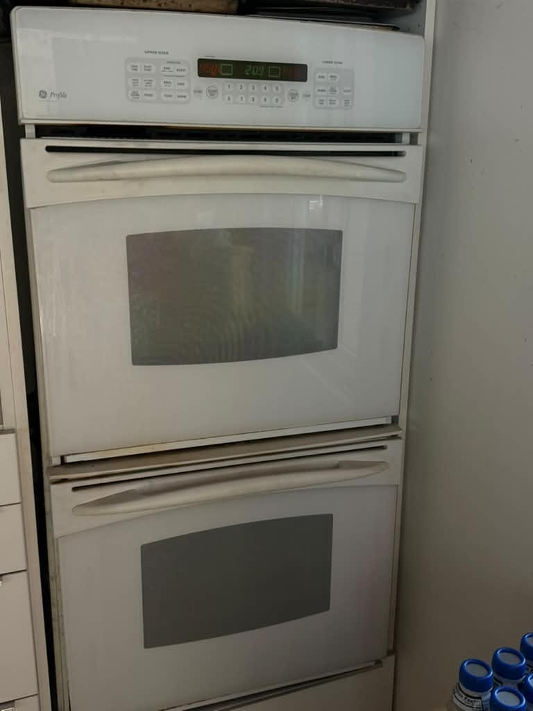 White GE Profile double wall oven built into kitchen cabinetry