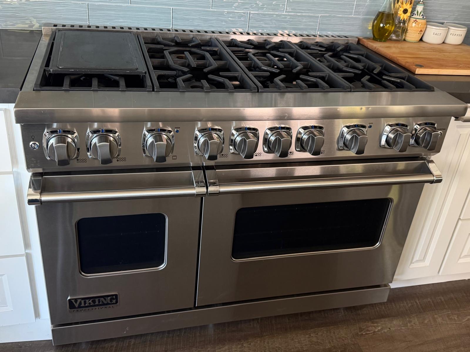 Stainless Viking professional range with two oven doors and a griddle