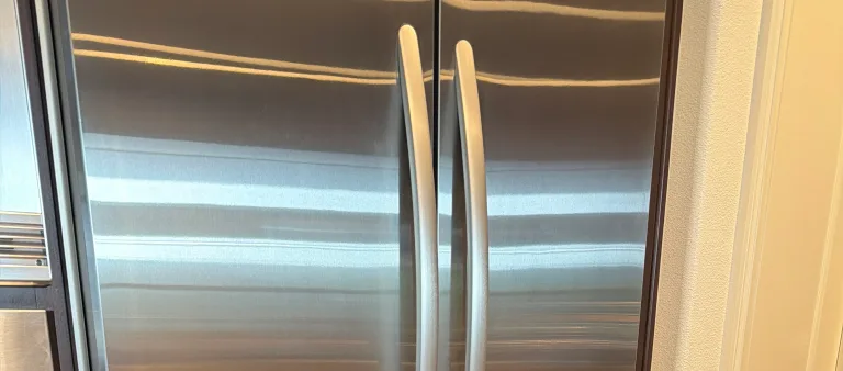 Photo from Donna Barnett Corwin's review showing the stainless French-door refrigerator and freezer we serviced