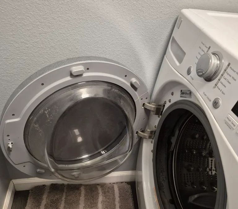 Photo from Carol Spetzman's review showing the open front-load washer we repaired